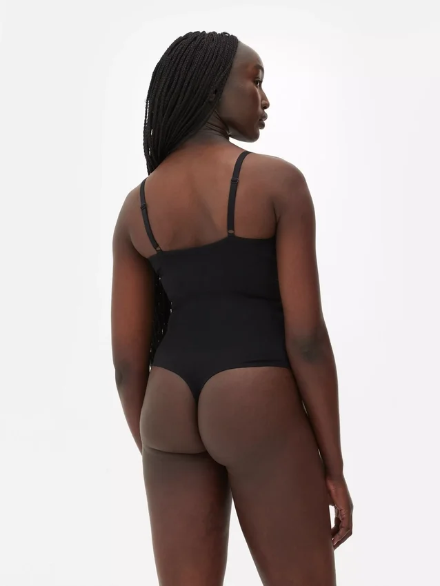 Kupakos tangás body