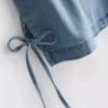 Pamut denim, oldalt kötős póló