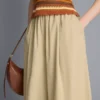Papírszerű tapintású, redős, hordószárú nadrág