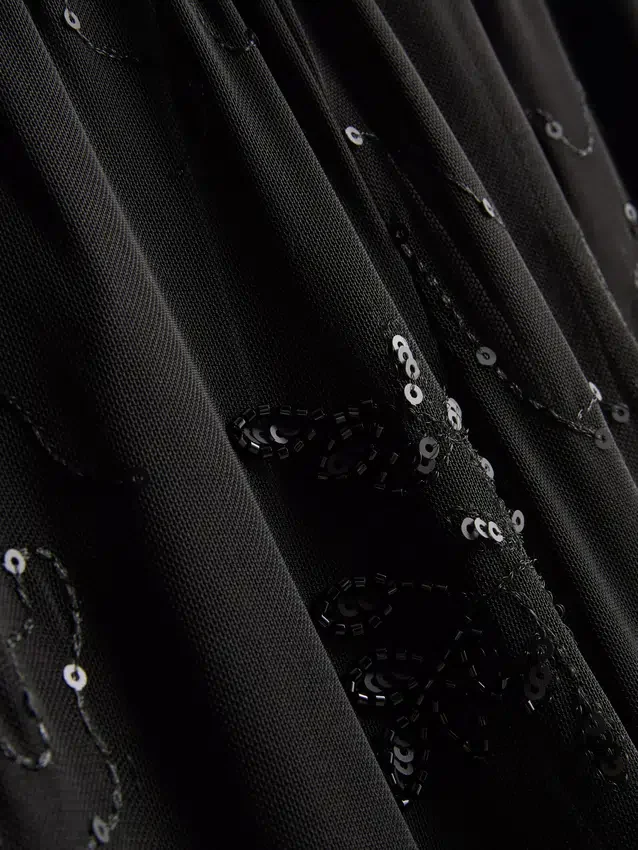 Paula Echevarría gyöngyös hálós, széles szárú nadrág