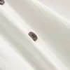 Texturált, gombos nyakkivágású, nyakpántos felső