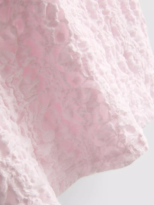 Texturált, magas nyakú felső